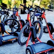 Group riding e-trikes through Athens
